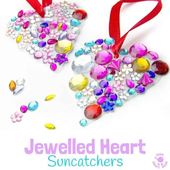 JEWELLED HEART SUNCATCHERS are so pretty! This is an easy recycled craft for kids and they make lovely gifts too. A great kids craft for Valentine's Day, Mother's Day and Summer. #valentine #valentinesday #valentinesdaycraft #valentinecraft #valentinescrafts #valentinecrafts #valentinesdayforkids #heart #love #heartcrafts #upcycledcraft #recycledcraft #suncatchers #suncatchercrafts #kidsart #ECE #kidscrafts #kidscraft #kidscrafts101 #craftsforkids #preschool #preK #earlyyears