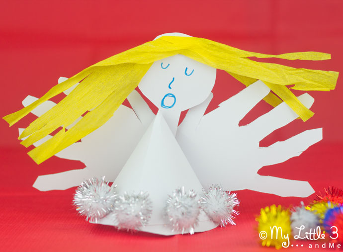 HANDPRINT ANGEL CRAFT- Fun Christmas ornaments for kids to make. These angels look great as tree toppers and are super keepsakes too.