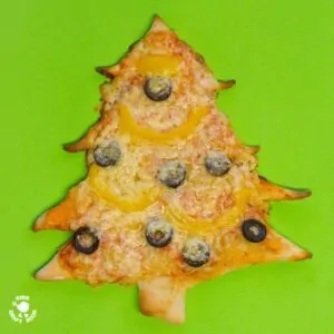CHRISTMAS TREE PIZZA - the perfect Christmas recipe for cooking with kids. #christmas #christmasecipe #cookingwithkids #christmasideas #christmasideasforkids #pizza #pizzarecipe #kidsactiviies #kidsrecipes #kidscraftroom