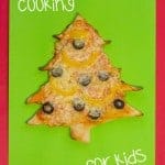 CHRISTMAS TREE PIZZA - the perfect Christmas recipe for cooking with kids. #christmas #christmasecipe #cookingwithkids #christmasideas #christmasideasforkids #pizza #pizzarecipe #kidsactiviies #kidsrecipes #kidscraftroom