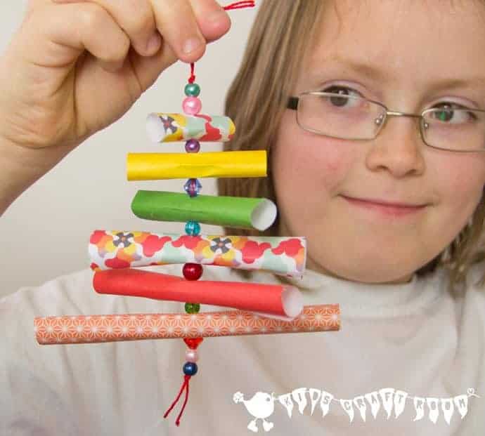 Have fun with paper & beads to make adorable homemade Christmas ornaments. Our paper tree decorations are so simple and pretty and great for children to enjoy making too!