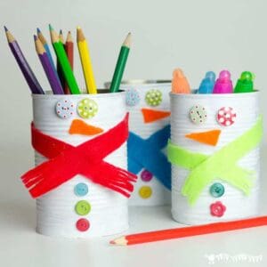 TIN CAN SNOWMAN CRAFT - Kids will love turning old tin cans into Snowman Desk Tidies and a Snowman Bowling Game with this cute and easy Tin Can Snowman Craft. A fun Winter craft for kids. #snowman #snowmancrafts #wintercrafts #wintercraftideas #wintercraftsforkids #recycledcrafts #tincan #craftideasforkids #kidscraftroom