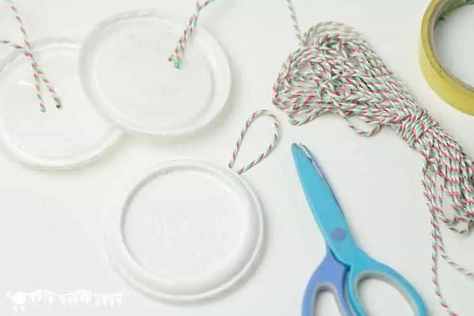 adding-thread-for-hanging-snowman-ornaments