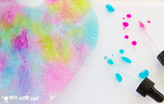 Pipette Drip Painting Hearts is a fun open ended process art for kids that develops fine motor skills, and explores colour mixing and pattern making. 