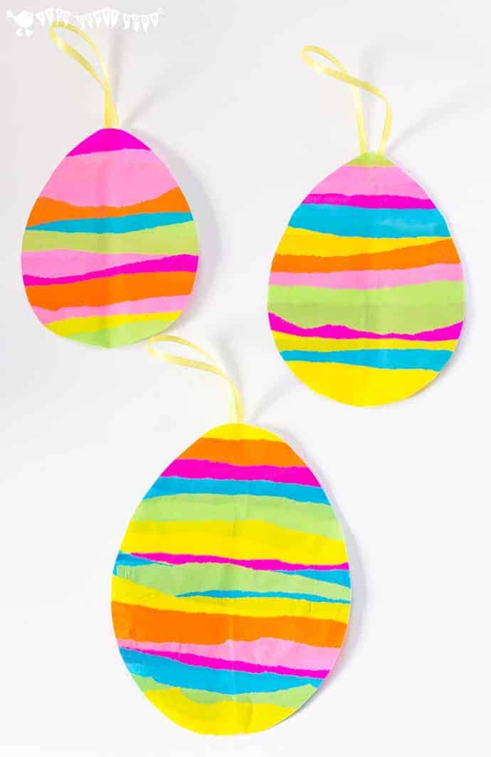 This EASTER EGG SUNCATCHER CRAFT for kids is so bright and colourful. They look beautiful hanging in windows and they can be hung outside for Easter egg hunts too.