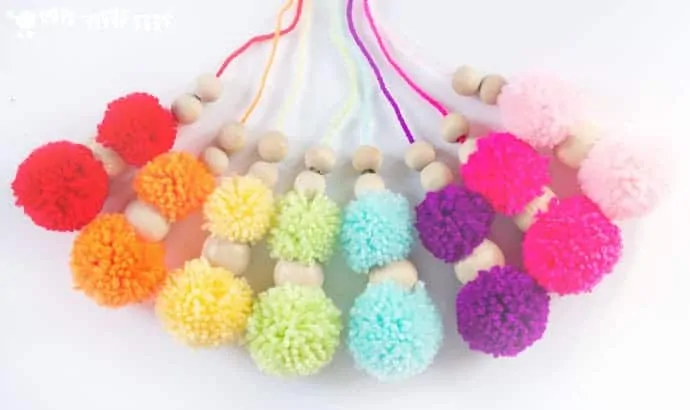 DIY RAINBOW POM POM MOBILE - brighten up your baby nursery, kids bedrooms or add a splash of colour to your living area with this cute and easy craft. A super way to use up yarn scraps.