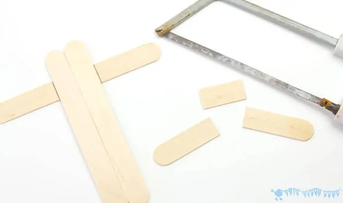 Cutting-popsicle-sticks-to-make-a-mix-n-match-snake-craft