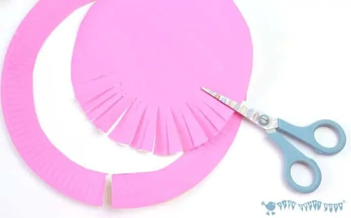 cutting-smaller-paper-plates-to-make-paper-plate-rosettes-grandparents-day-craft