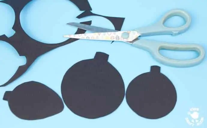 Cutting-Black-Card-To-Make-Homemade-Baubles-With-Posca-Pens