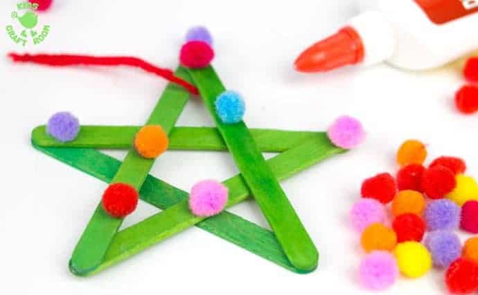 These colourful pom pom popsicle stick stars will look amazing hanging on your Christmas tree or as a bright and cheery bedroom or nursery display all year round.
