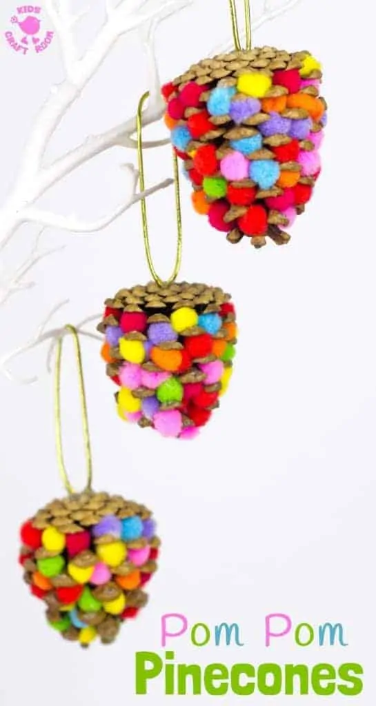 POM POM PINECONES - This colourful Pom Pom Pinecone craft for kids looks great! Use this nature craft to make Christmas ornaments or as pretty mobiles all year. There's even a fun idea for a colourful pinecone math game too. #naturecrafts #pineconecrafts #pompomcrafts #kidscrafts #craftsforkids #kidsactivities #kidscraftroom #christmas #christmasornaments #ornaments