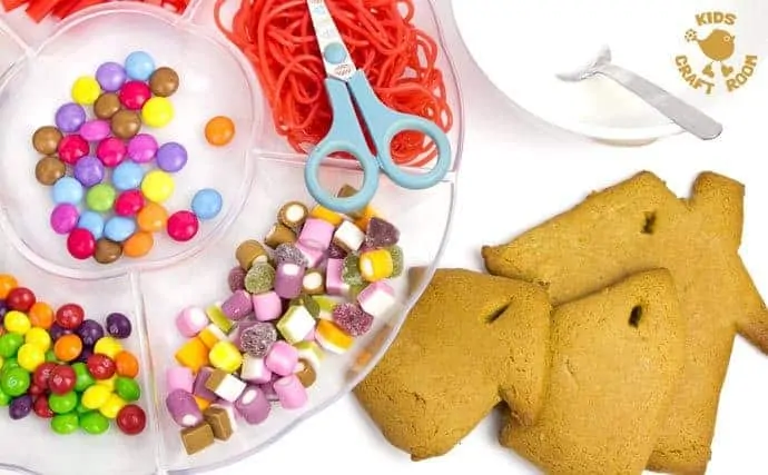This easy gingerbread house recipe is great fun for the whole family. Forget the frustrations of 3D houses that fall down and make pretty 2D gingerbread houses instead. Just as pretty and delicious but without all the hassle! These cute gingerbread houses can be hung on the Christmas tree and given as gifts too-step 4