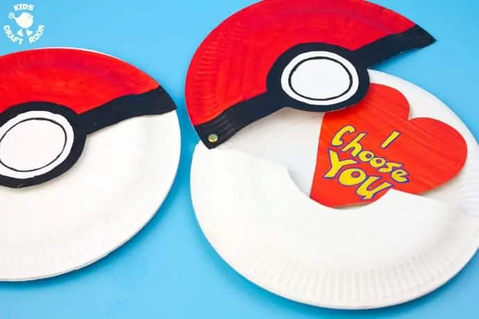 This Paper Plate Pokeball craft actually opens with storage space inside for figures, or cards! We've turned ours into a cute "I Choose You" Pokemon Valentine! This is such a fun Pokemon craft for kids. #valentine #valentinesday #valentinescraft #valentinecraft #valentinescrafts #valentinecrafts #valentinesdayforkids #heart #love #pokemon #pokeball #kidscrafts #paperplatecrafts #paperplate #kidscraftroom