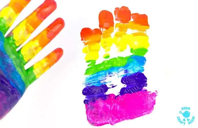 HANDPRINT RAINBOW PAINTING is a fun sensory art experience for kids. Get "hands-on" with paints and explore colour mixing and blending! A creative painting idea for St Patrick's Day and weather study themes.