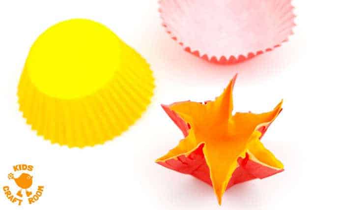 POP UP DAFFODIL CRAFT Step 4 - A simple Spring craft perfect for Easter or Mother's Day too. This cupcake liner and paper plate flower craft lets kids pretend to grow their own daffodils again and again! 