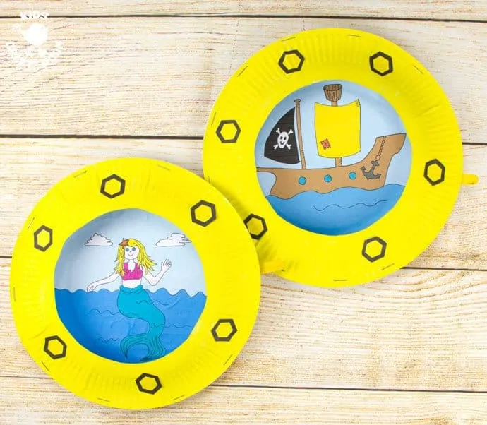 PAPER PLATE PORTHOLE CRAFT - a fantastic ocean craft for kids that love pirates and mermaids. This interactive moving paper plate craft is so fun! Wiggle the handle to make the ocean scene bob up and down like real waves! An exciting Summer craft for kids. (Free black & white and full colour printables available.)