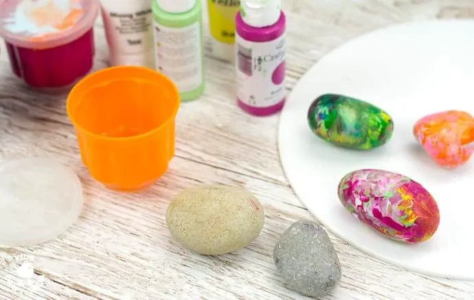 Step 1- SHAKE PAINTING - CUTE SNAIL ROCK CRAFT- This rock painting idea gets kids active and is virtually mess free! With this cute Snail Craft kids shake out their wiggles and fidgets and create beautifully painted rocks that make perfect snail shells! Grab your rocks, your kids and your wiggles and let's get making cute snails. It is so much fun and each one is unique!