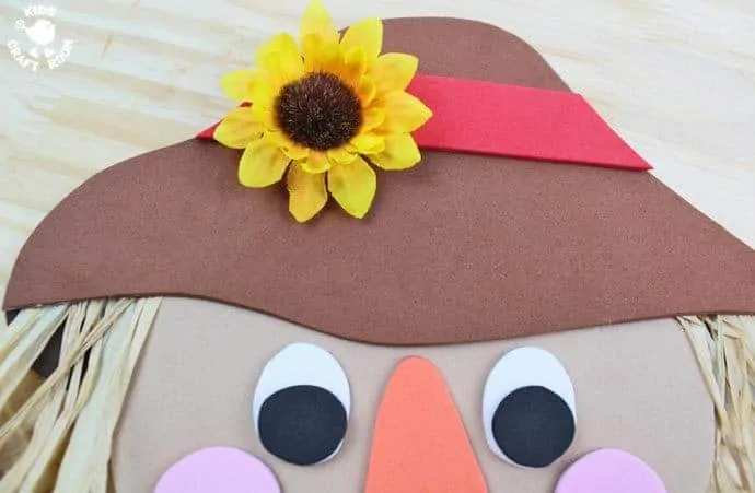 Step 11 - FOAM SCARECROW CRAFT - This cute foam scarecrow craft is great as a Fall craft or for harvest time and Thanksgiving. A free printable scarecrow template makes it super easy and fun to make.