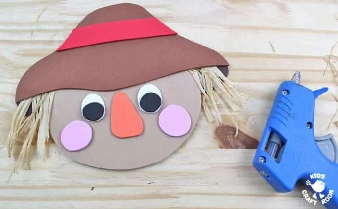Step 7 - FOAM SCARECROW CRAFT - This cute foam scarecrow craft is great as a Fall craft or for harvest time and Thanksgiving. A free printable scarecrow template makes it super easy and fun to make.