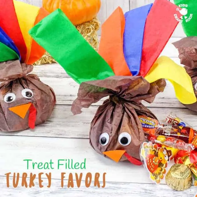 CANDY-FILLED TURKEY FAVORS - stuff this cute turkey craft with everyone's favorite Fall candies and they'll be gobbled up before you can say "Thanksgiving Treat"! Candy stuffed Turkey Favours are super simple and so much fun! Kids will love to make them and give them to their friends and they'll look super adorable in everyone's place setting for Thanksgiving dinner.
