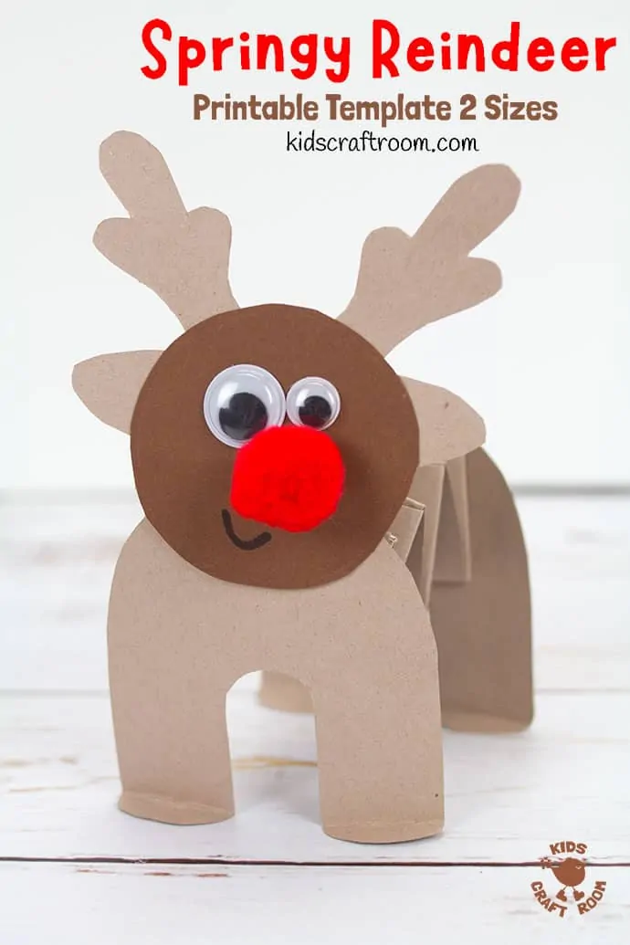 A close up of a paper reindeer. Its body is made from a folded paper accordion spring. It has a red pompom nose and wiggle eyes.