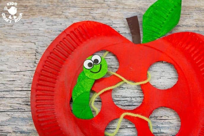A close up of the worm in the Paper Plate Apple Lacing Craft.