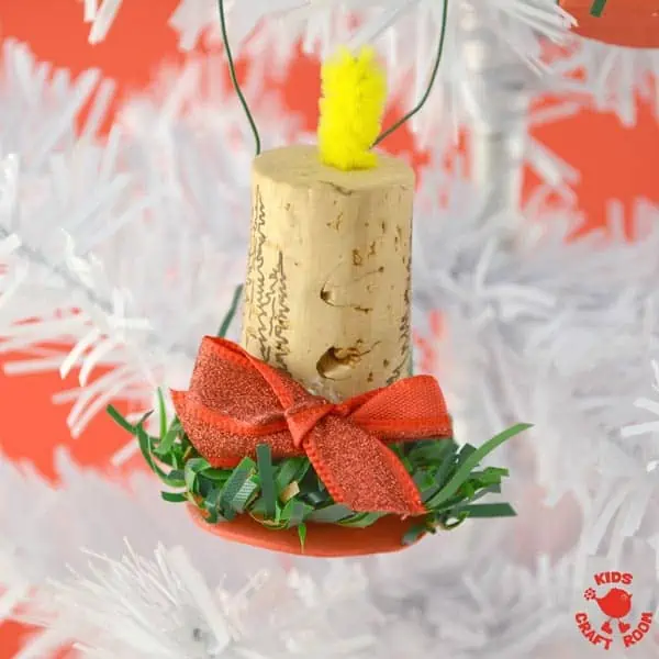 A close up of a Cork Candle Christmas Ornament.