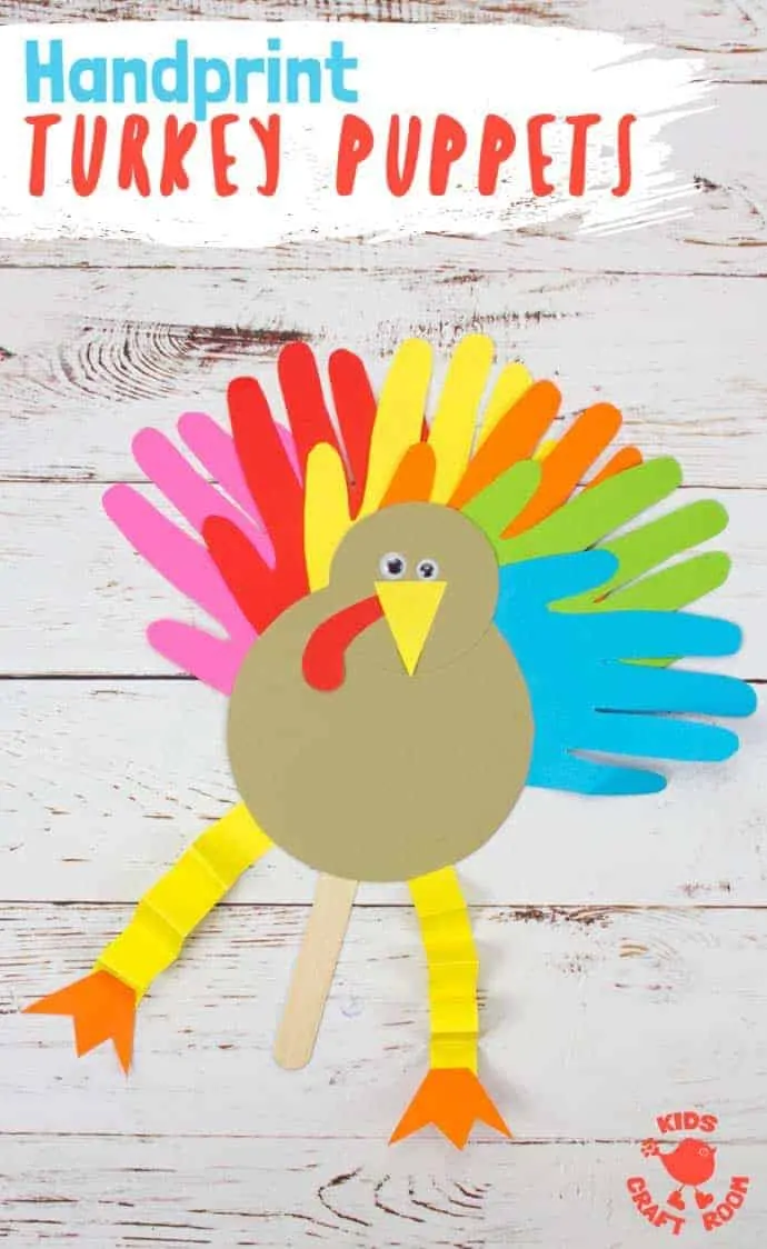 A close up of a finished Thanksgiving Handprint Turkey Puppet. It has a paper body, yellow concertina folded legs, wiggle eyes and colourful handprint tail feathers.