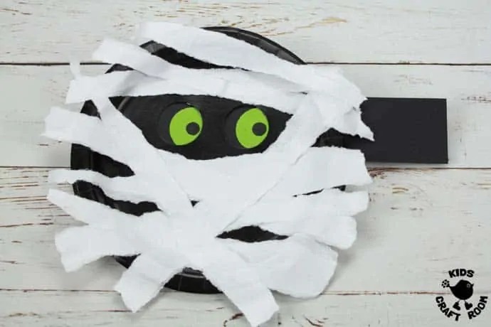 Step 9 Moving Eyes Paper Plate Mummy Craft.