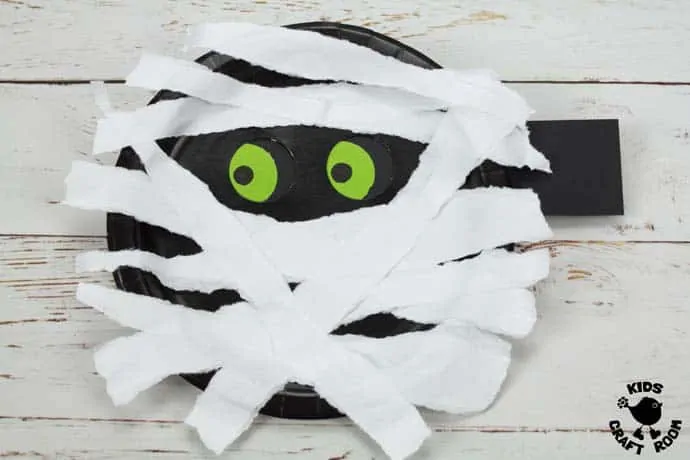Step 8 Moving Eyes Paper Plate Mummy Craft.