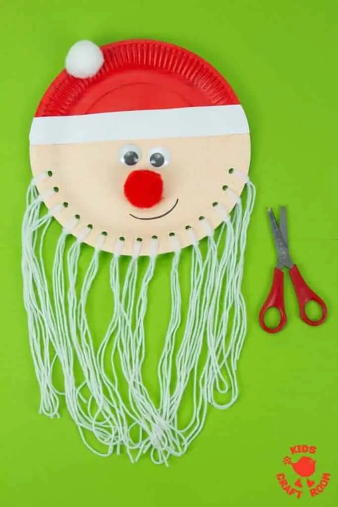 Are you looking for an educational Santa craft idea to enjoy with your toddlers and preschoolers this Christmas? This Trim The Beard Paper Plate Santa Craft is adorably cute and gives kids lots of opportunity to develop their fine motor cutting skills and have fun! #santa #santacrafts #paperplatecrafts #christmas #christmascrafts #christmascraftskids #fatherchristmas #fatherchristmascrafts #kidscrafts #finemotorskills #kidscraftroom