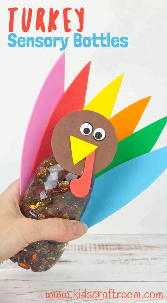 A Thanksgiving Turkey Sensory Bottle being held on its side to show the glitter moving around inside it.