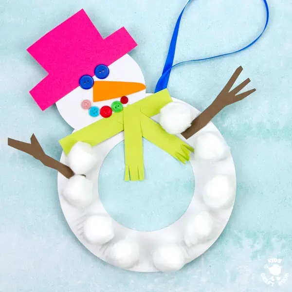 A close up of a Paper Plate Snowman Wreath showing it's tummy made from cotton balls.