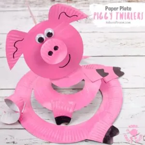 This Paper Plate Pig Twirler is adorable! A simple pig craft that's really quick and easy to make. Hold your pig twirler craft up and give it a blow to see it spin round and round. Such a fun paper plate craft for kids. Great for farm animal themes and Chinese year of the pig. #kidscraftroom #pigcrafts #pigs #paperplates #paperplatecrafts #twirlers #whirligigs #preschoolcrafts #toddlercrafts