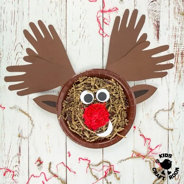 A close up of a Handprint and Paper Plate Reindeer Craft showing the texture of the paper straw.