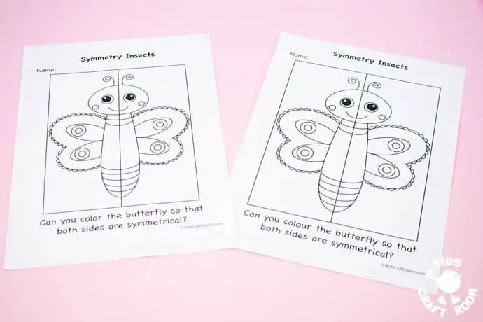 2 butterfly symmetry worksheets on a pink table top.