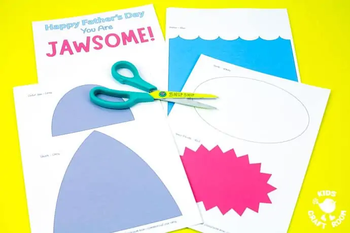 Shark Father's Day Card templates on a yellow table top. Step 1.