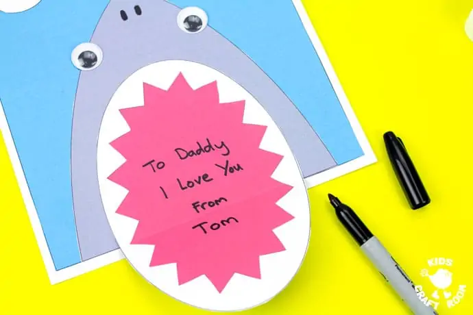 Shark Father's Day Card on a yellow table top. Step 10.