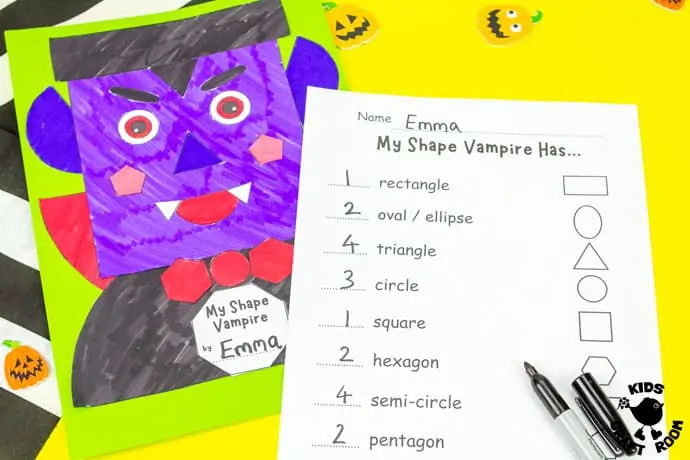 Shape Vampire Halloween Craft on a yellow desk top.