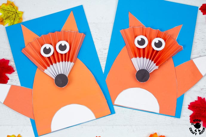 2 Paper Fan Fox Crafts lying side by side on a white table top.