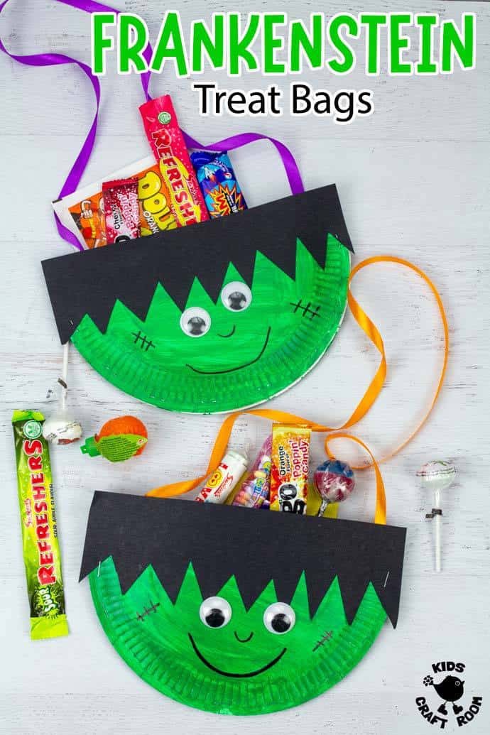 2 Paper Plate Frankenstein Treat Bags filled with candy, lying on a white table top.