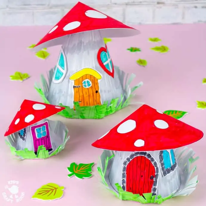 Mushroom Fairy House Craft square image of three fairy houses on a pink table top.