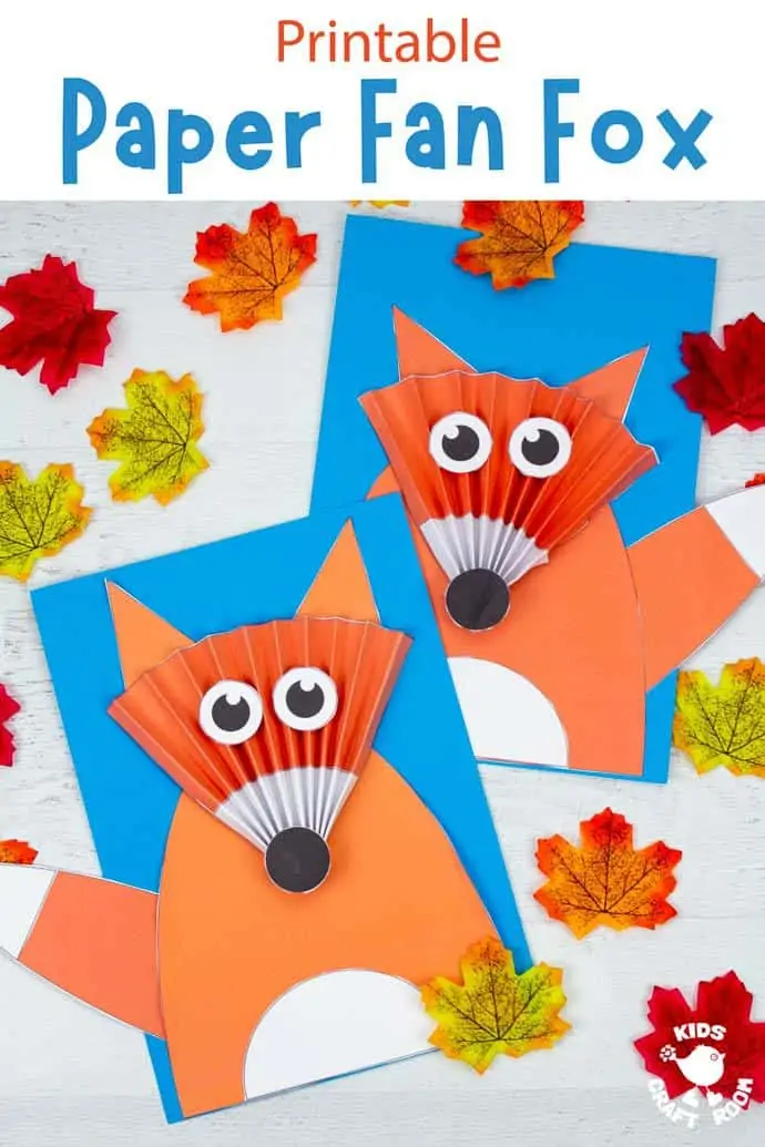 2 Paper Fan Fox Crafts on white table top surrounded by autumn leaves.