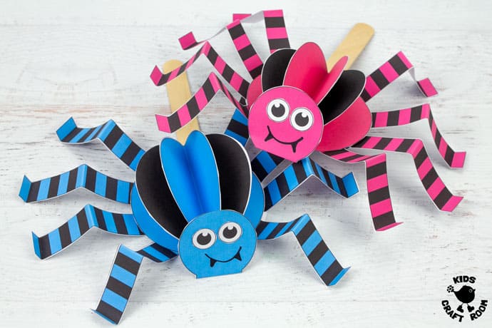 2 Walking Spider Puppet Crafts placed in a pile on a table top.