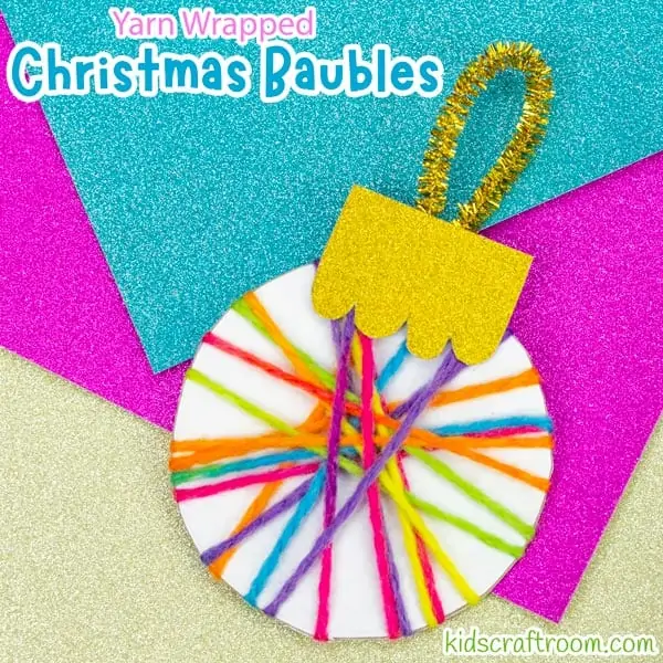 A close up of a Yarn Wrapped Christmas Bauble Craft, showing the sparkly gold pipe cleaner hanging loop.