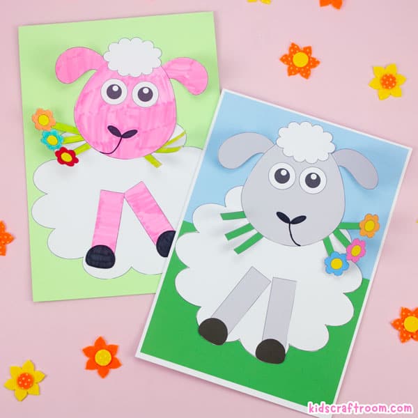 2 completed lamb crafts, one pink, one white lying on a pink table top surrounded by felt daffodils.