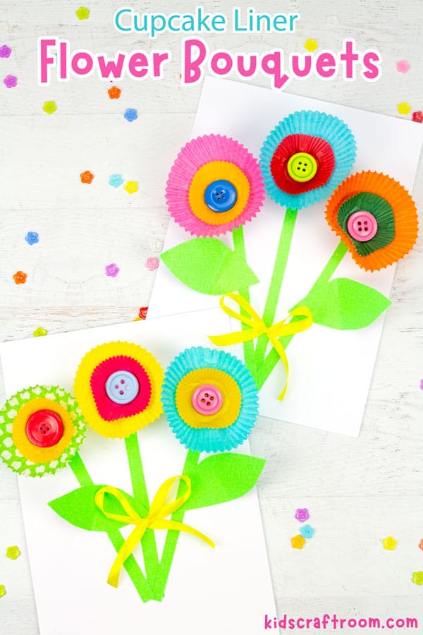 Cupcake Liner Flower Crafts lying on a tabletop with colourful buttons scattered around them.