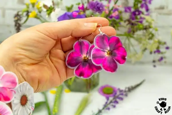 Pink earrings made from real flowers and shrink plastic.