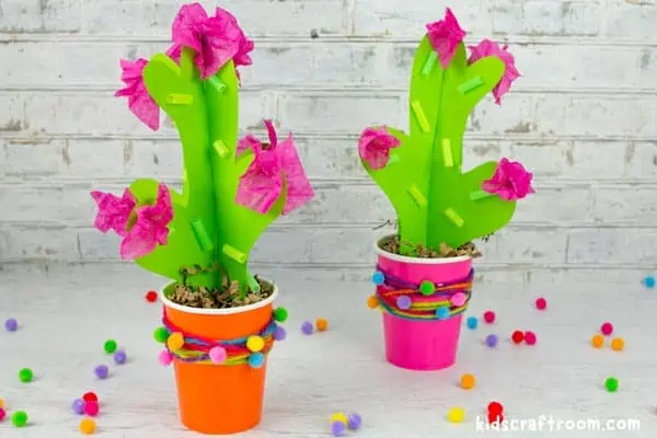 2 Colourful 3D Cactus Craft side by side. The left has an orange pot, the right has a pink pot.