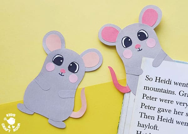 A close up of 2 mouse bookmark crafts on a yellow backdrop.
